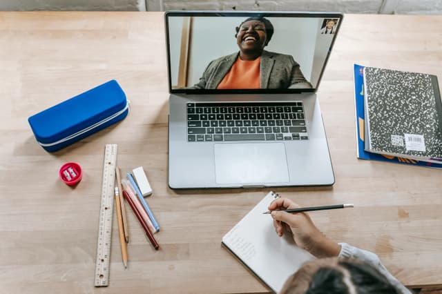 Teacher on video call with student