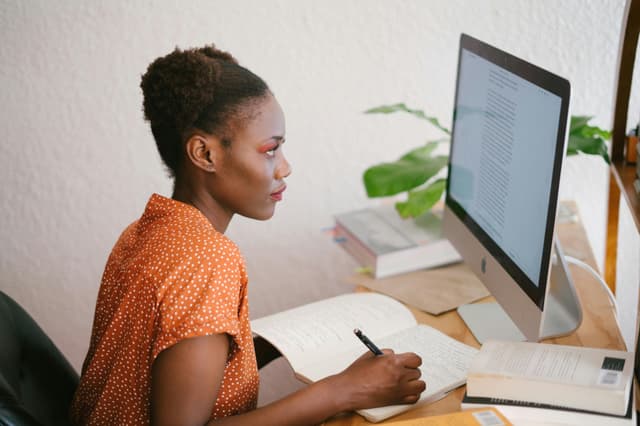 Educator preparing lesson materials at a desk